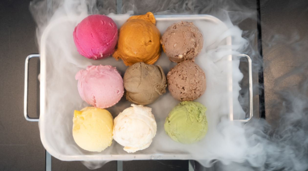 A tray holding colorful scoops of ice cream surrounded by a white mist at the Mid Hudson Discovery Museum in Poughkeepsie